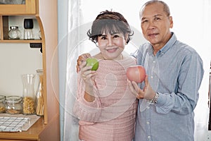 Portrait of happy couple senior asia woman and retirement man having breakfast together