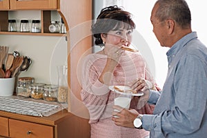 Portrait of happy couple senior asia woman and retirement man having breakfast together