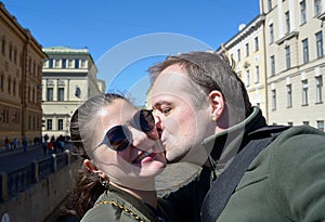 Portrait of happy couple on streets of St. Petersburg