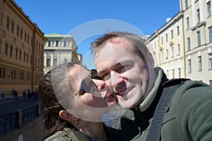 Portrait of happy couple on streets of St. Petersburg