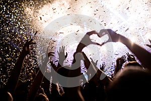 Portrait of happy crowd enjoying at music festival