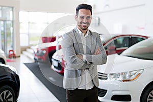 Portrait of happy customer buying new car