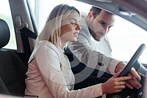 Portrait of happy customer buying new car