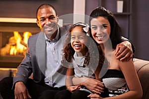 Portrait of happy diverse family at home