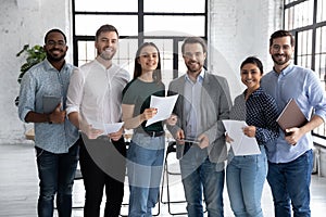 Portrait of happy diverse group of interns or students