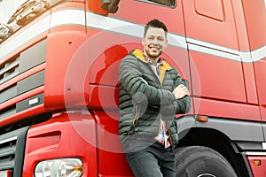 Portrait of happy driver at modern truck