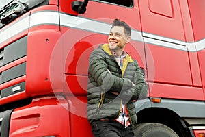 Portrait of happy driver at modern truck