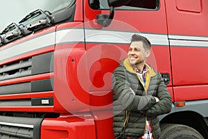 Portrait of happy driver at modern truck