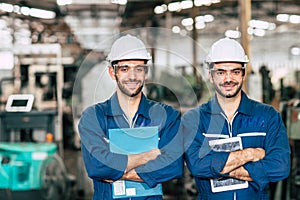 Portrait of Happy Engineer team smiling worker working together in industry factory