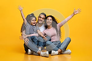 Portrait Of Happy Excited Middle Eastern Family Of Three With Little Daughter