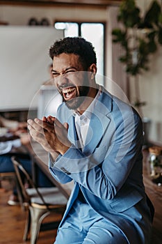 Portrait of happy, excited young businessman after closing a business deal.