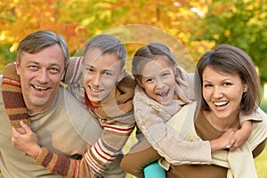 Portrait of Happy family in autumn park