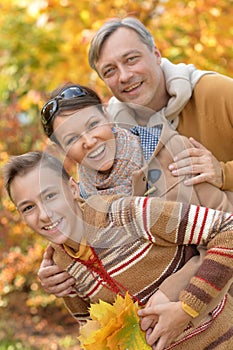 Portrait of Happy family in autumn park