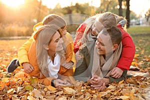 Portrait of happy family in autumn park