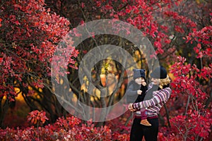 Portrait of happy family, autumn park outdoors