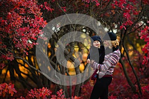 Portrait of happy family, autumn park outdoors