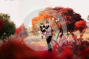 Portrait of happy family, autumn park outdoors