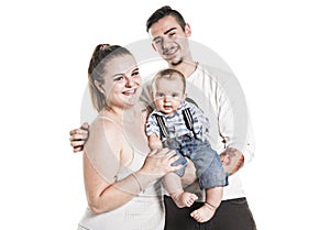 Portrait of the happy family with baby boy standing on white background.