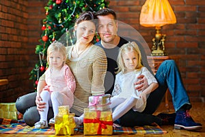 Portrait of a happy family celebrating Christmas at home