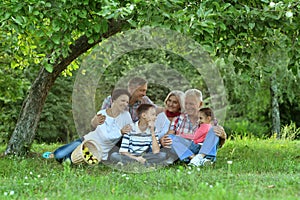 Portrait of happy family with children in park