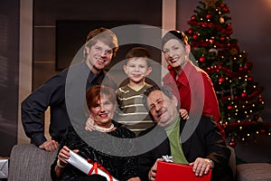 Portrait of happy family at christmas eve