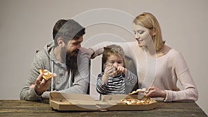 Portrait of happy family eating pizza. Hot pizza slice. Slice of fresh italian classic original Pepperoni Pizza isolated