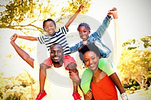 Portrait of happy family enjoying at park