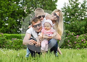 Portrait Of Happy Family In Garden