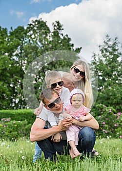 Portrait Of Happy Family In Garden