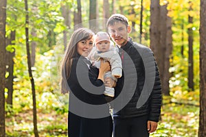 Portrait Of Happy Family In Garden