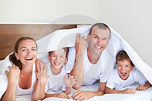 Portrait of happy family in home