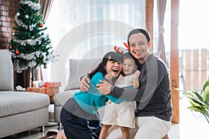 Portrait of happy family hugging each other