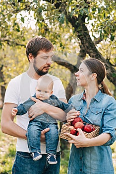 Portrait of Happy family hugging and spending time together outside in green nature