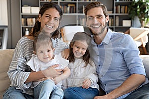 Portrait of happy family with kids relax on couch