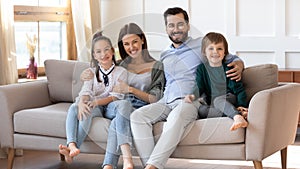 Portrait of happy family with kids relax at home