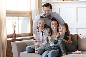 Portrait of happy family with kids relax at home