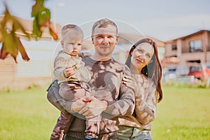 Portrait happy family mom dad and son having fun and enjoying spending time together in autumn park on sunny day