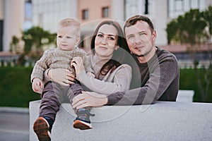 Portrait happy family mom dad and son walking around the city, having fun and enjoying spending time together