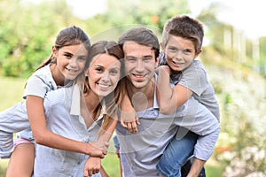 Portrait of happy family outdoors