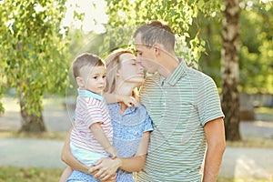 Portrait of a happy family in the park.