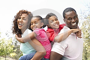 Portrait of Happy Family In Park