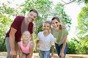 Portrait of happy family in park