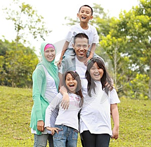 Portrait of Happy Family In Park