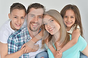 Portrait of happy family posing at home