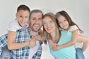 Portrait of happy family posing at home