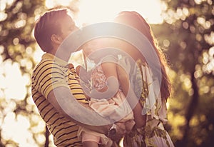 Portrait of happy family at spring season.