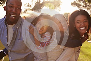 Portrait Of Happy Family In Summer Garden