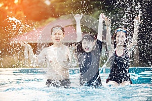 Portrait of happy Family In Swimming Pool.