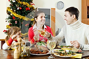 Portrait of Happy family of three celebrating Christmas