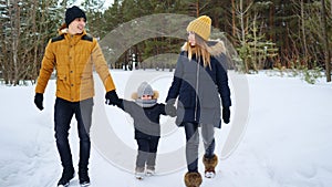 Portrait of happy family walk in winter day.
